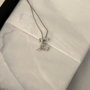 Brand new White Gold E with diamonds. From Neumann Marcus.